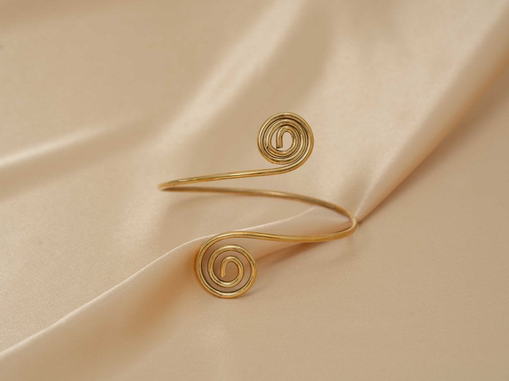Aphrodite Spiral Cuff handmade brass arm cuff in gold — Land of Sundara