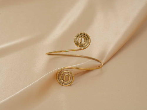 Aphrodite Spiral Cuff handmade brass arm cuff in gold — Land of Sundara
