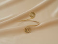 Aphrodite Spiral Cuff handmade brass arm cuff in gold — Land of Sundara