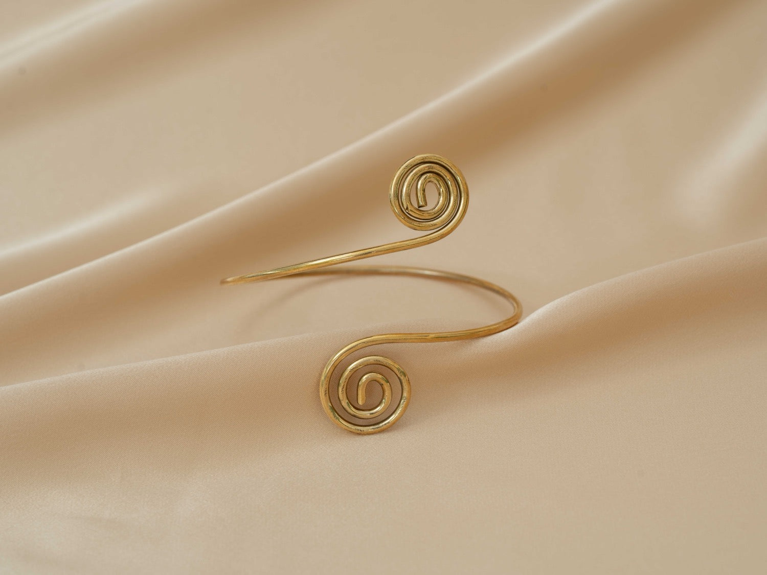 Aphrodite Spiral Cuff handmade brass arm cuff in gold — Land of Sundara
