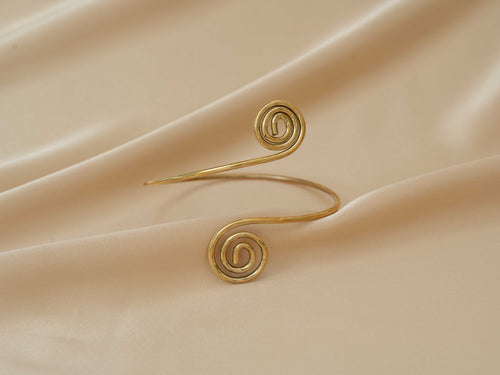 Aphrodite Spiral Cuff handmade brass arm cuff in gold — Land of Sundara
