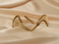 Inanna wave handmade brass arm cuff in gold — Land of Sundara