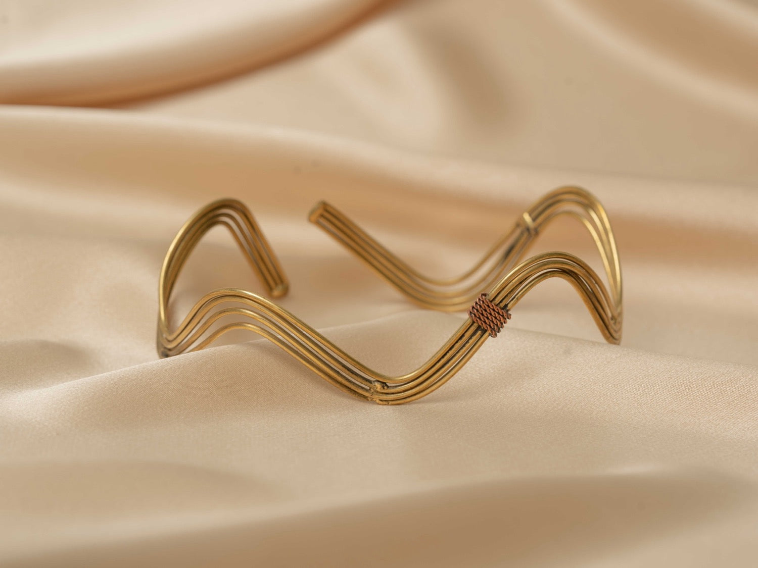 Inanna wave handmade brass arm cuff in gold — Land of Sundara