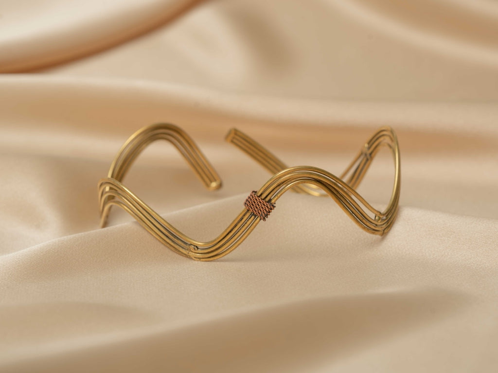 Inanna wave handmade brass arm cuff in gold — Land of Sundara