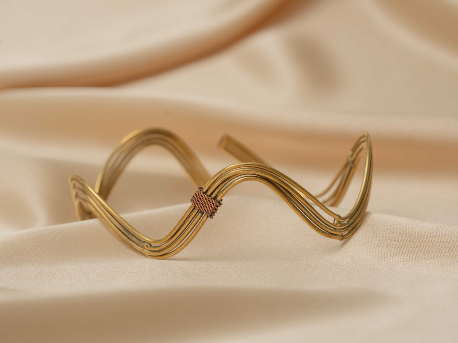 Inanna wave handmade brass arm cuff in gold — Land of Sundara