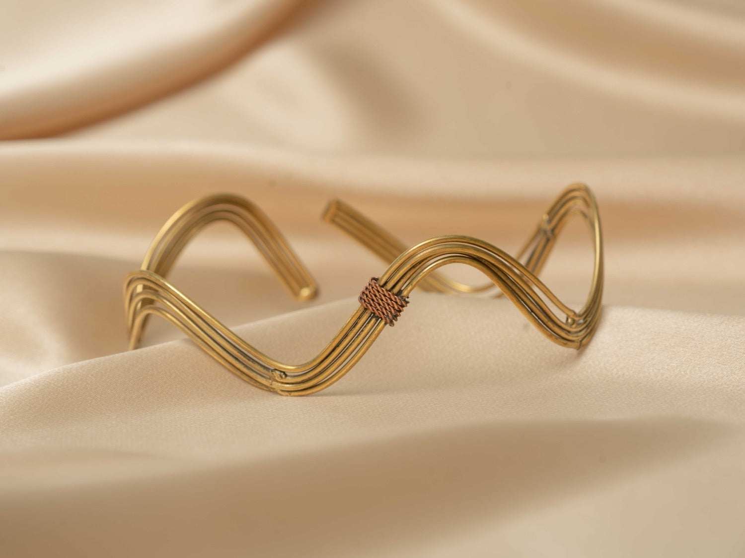 Inanna wave handmade brass arm cuff in gold — Land of Sundara