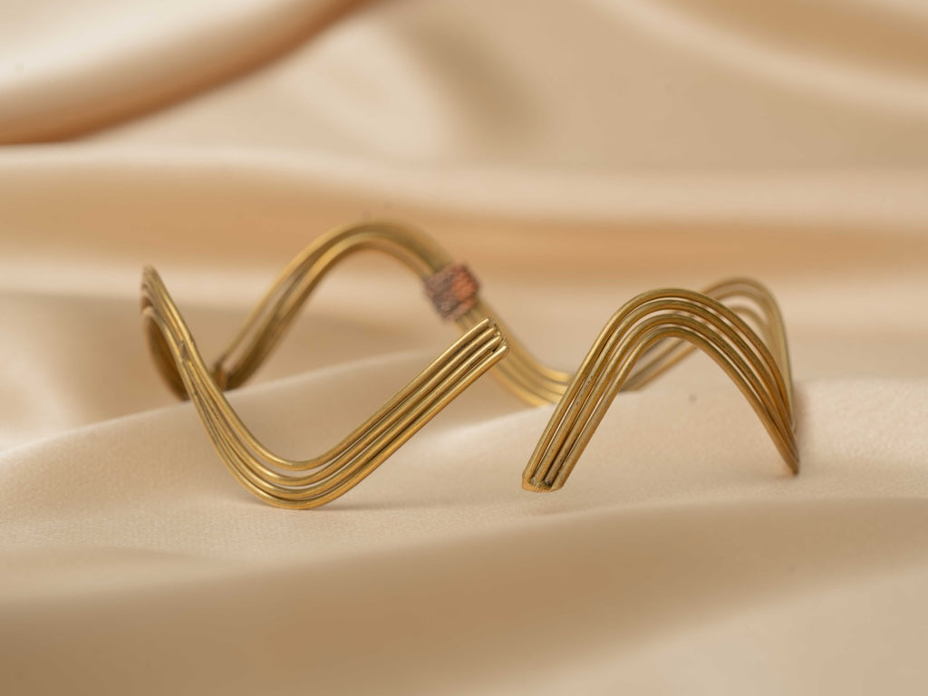 Inanna wave handmade brass arm cuff in gold — Land of Sundara