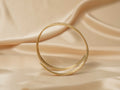 Siren Spiral Cuff handmade brass arm cuff in gold — Land of Sundara
