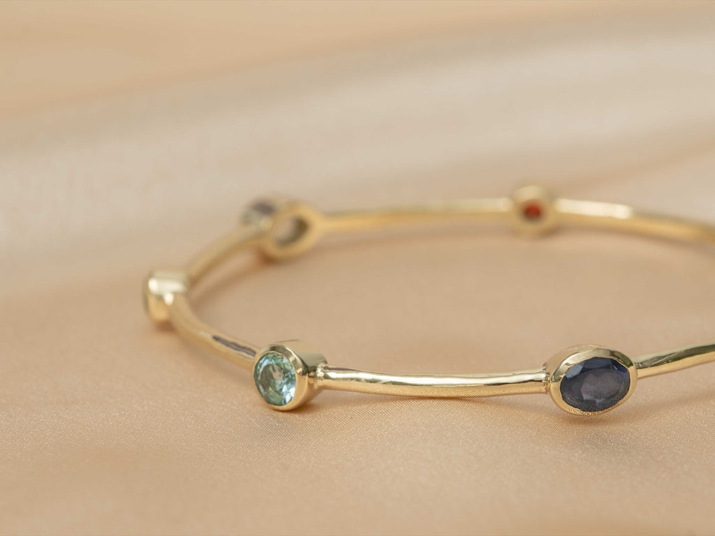 Aurelia Gem Bangle handmade brass bracelet with blue topaz / peridot / amethyst / iolite / carnelian / garnet