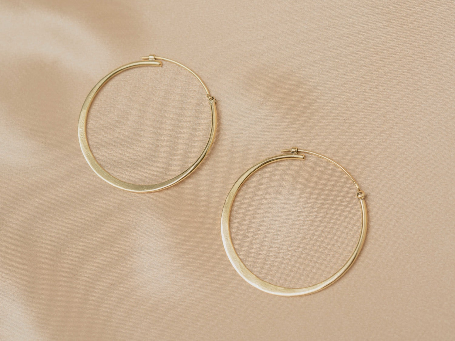 Horizon Hoop handmade brass earring in gold — Land of Sundara