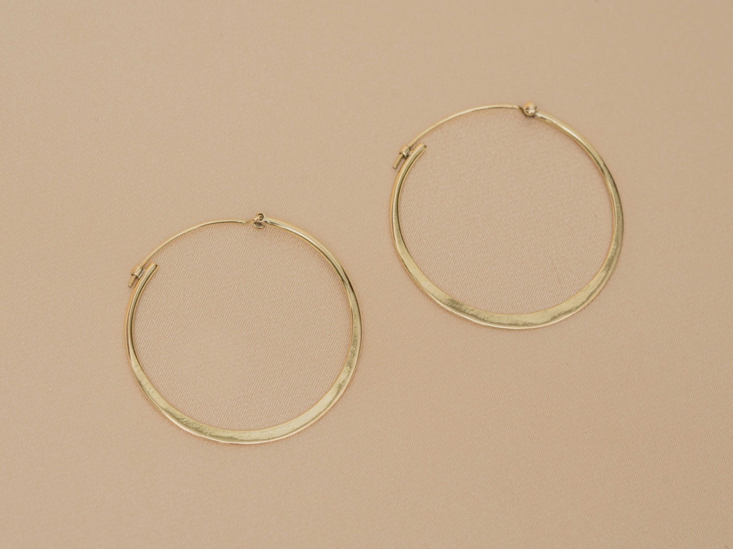 Horizon Hoop handmade brass earring in gold — Land of Sundara