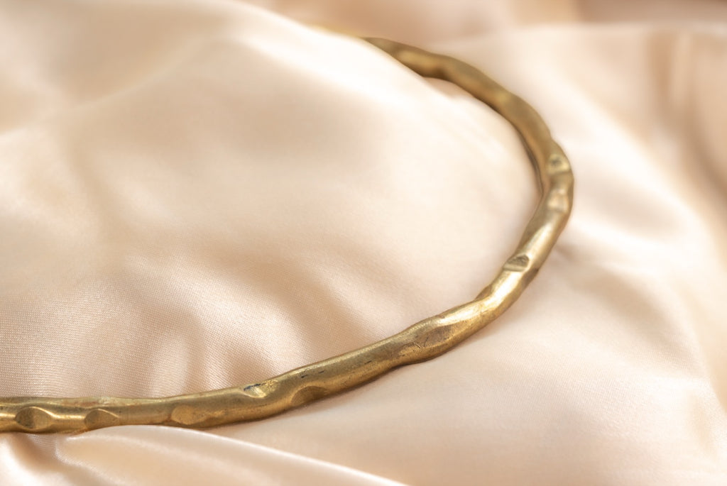 Hammered circle handmade brass necklace in gold — Land of Sundara