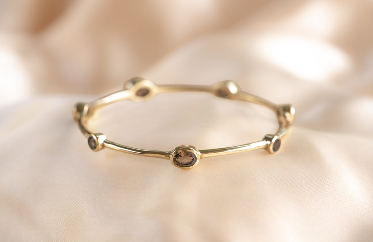Aurelia Smoulder Bangle handmade brass bracelet with smokey quartz stone — Land of Sundara
