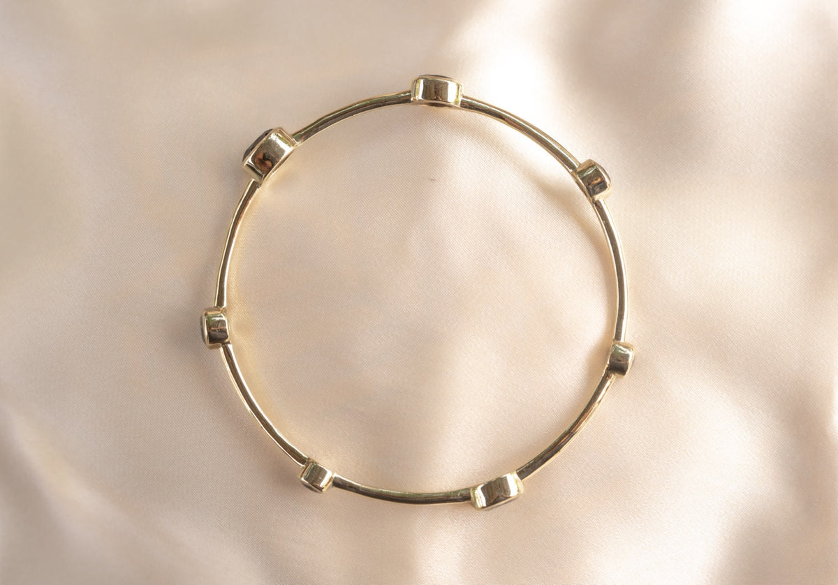 Aurelia Smoulder Bangle handmade brass bracelet with smokey quartz stone — Land of Sundara