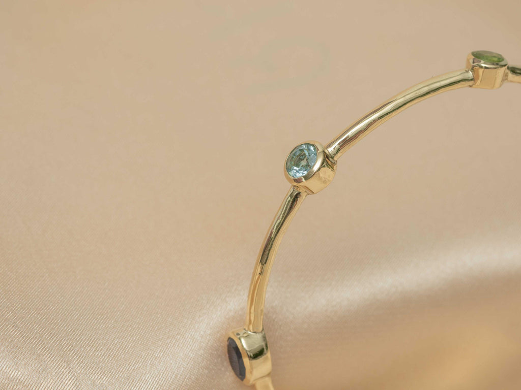 Celestial Harmony 7-Stone Brass Bangle