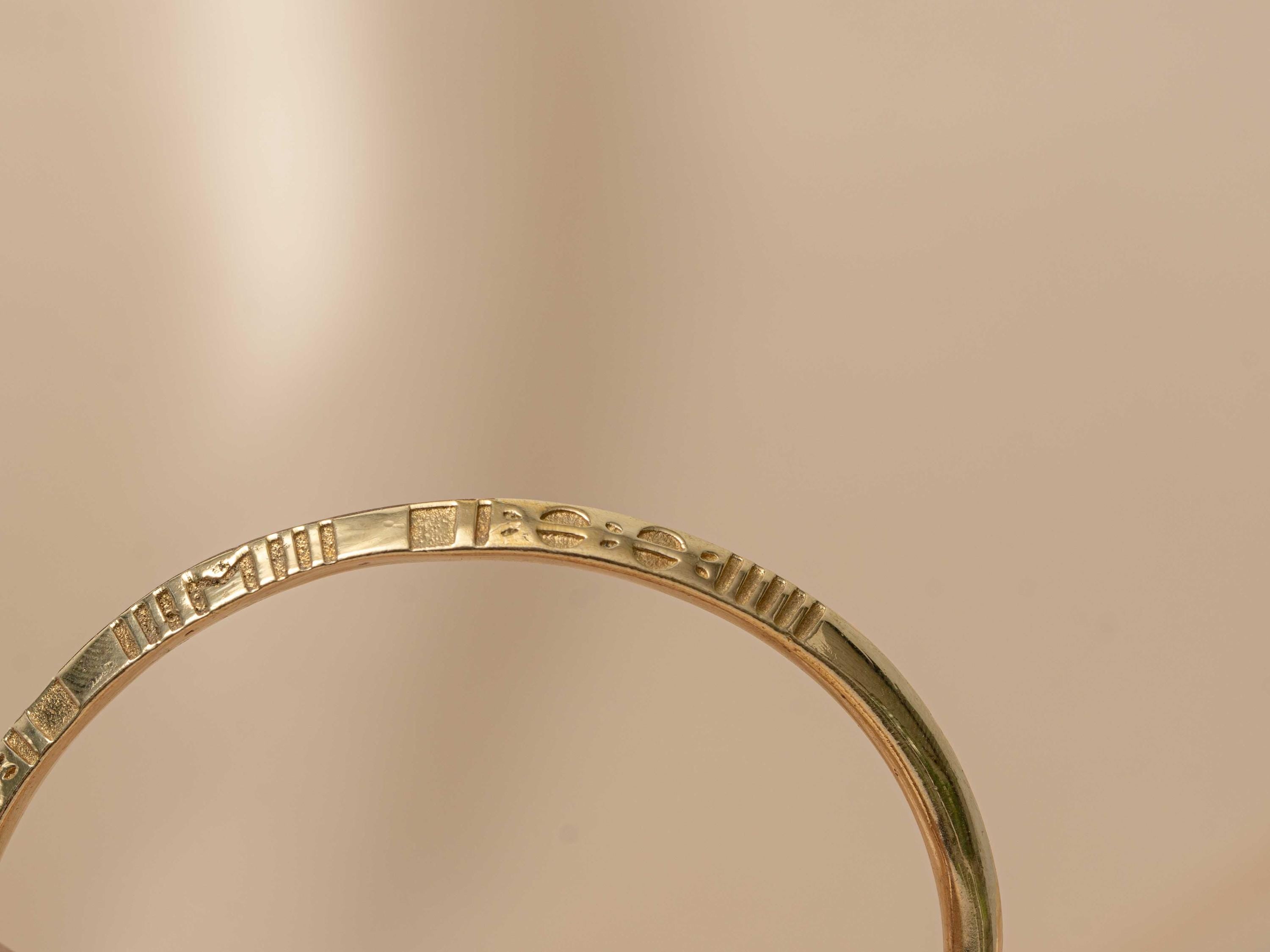 Sphinx Engraved Gold Bangle  - need description